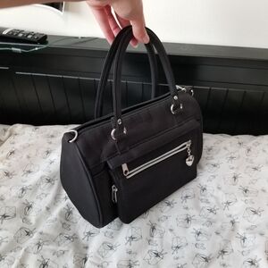 Sold Black handbag with heart charm and silver details